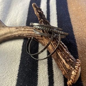 Multiple dark silver cuffed bracelets